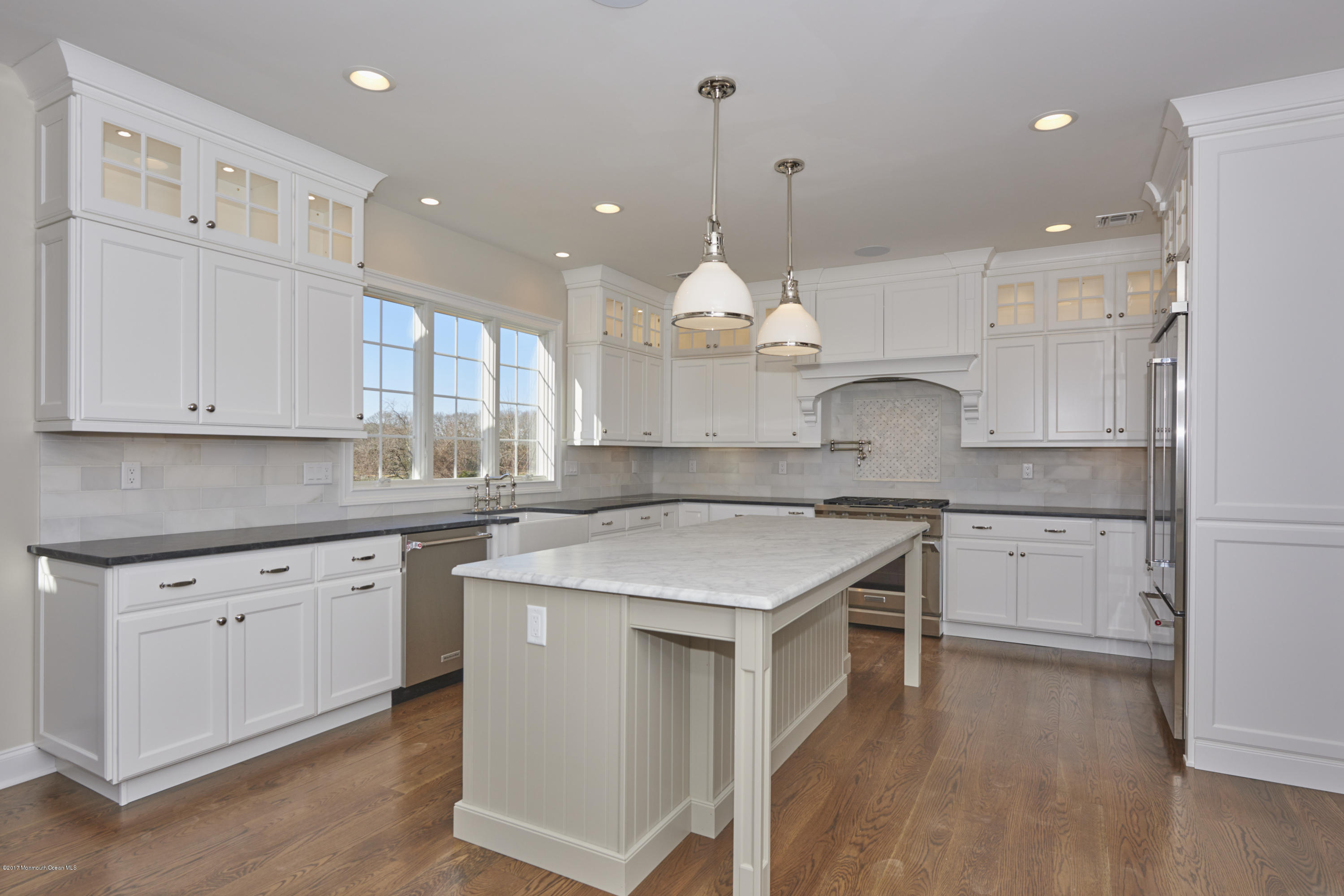 3 Forrest Way Colts Neck, NJ 07722 - Photo 11 of 26 a kitchen with a sink cabinets and wooden floor