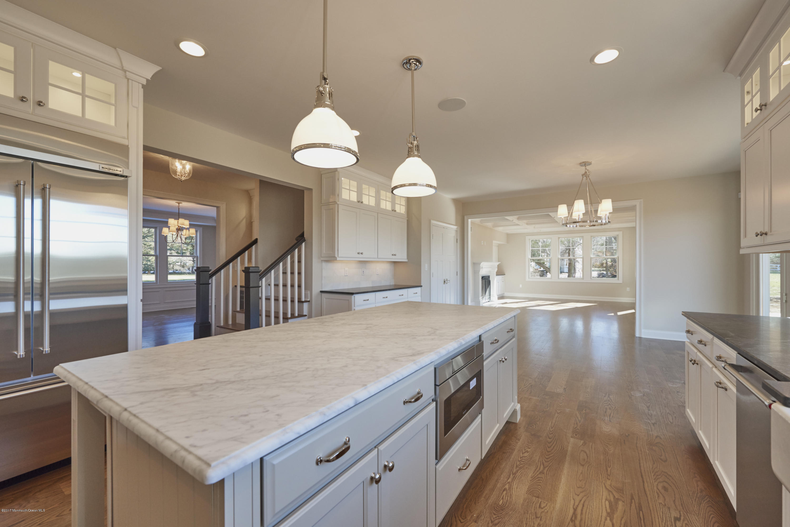 3 Forrest Way Colts Neck, NJ 07722 - Photo 12 of 26 a view of a kitchen island a chandelier and wooden floor