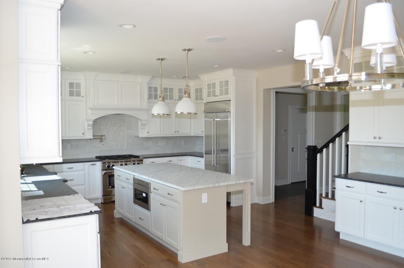 3 Forrest Way Colts Neck, NJ 07722 - Photo 13 of 26 a kitchen with stainless steel appliances granite countertop a stove and a sink