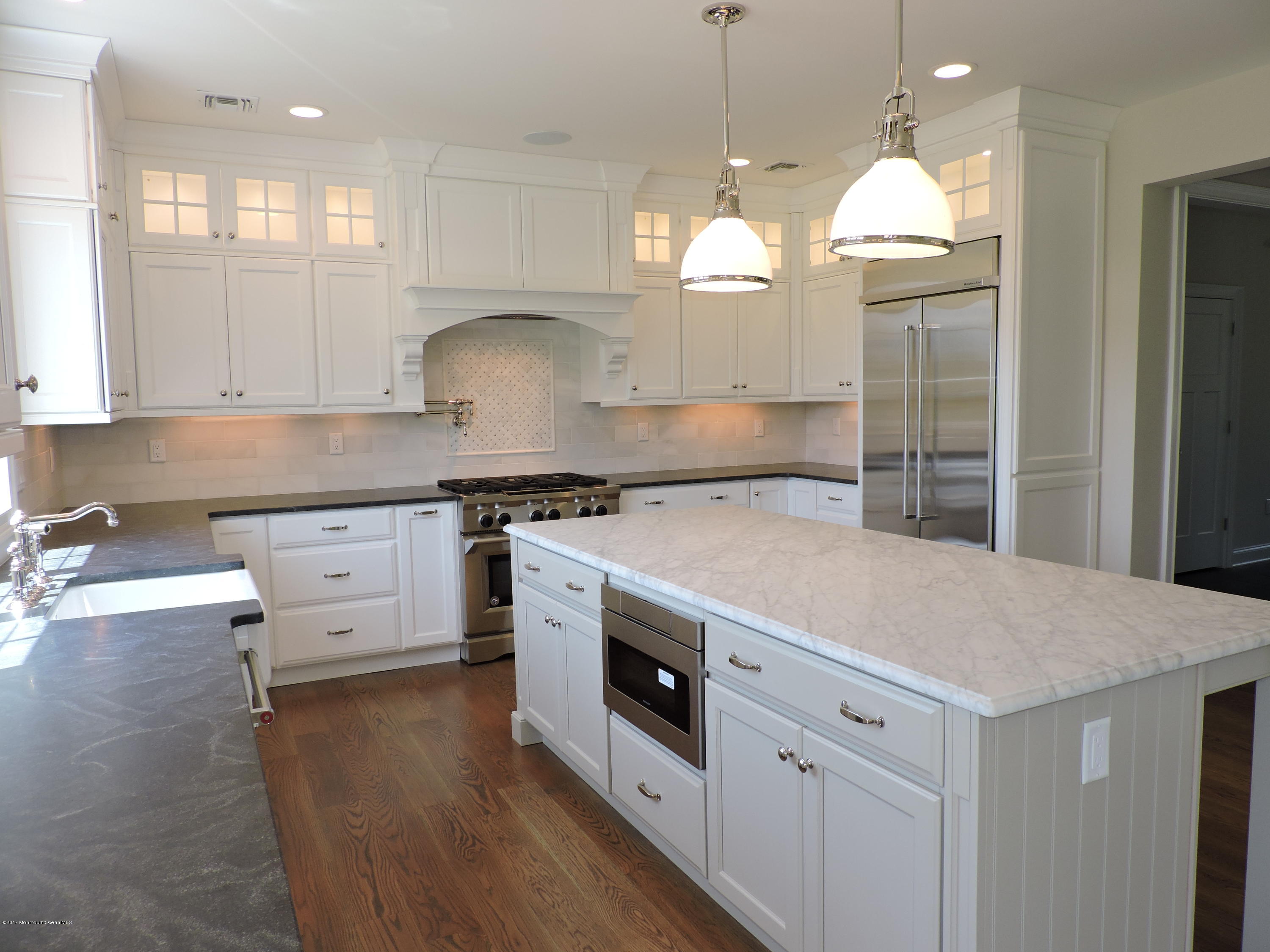 3 Forrest Way Colts Neck, NJ 07722 - Photo 14 of 26 a kitchen with granite countertop white cabinets and white appliances