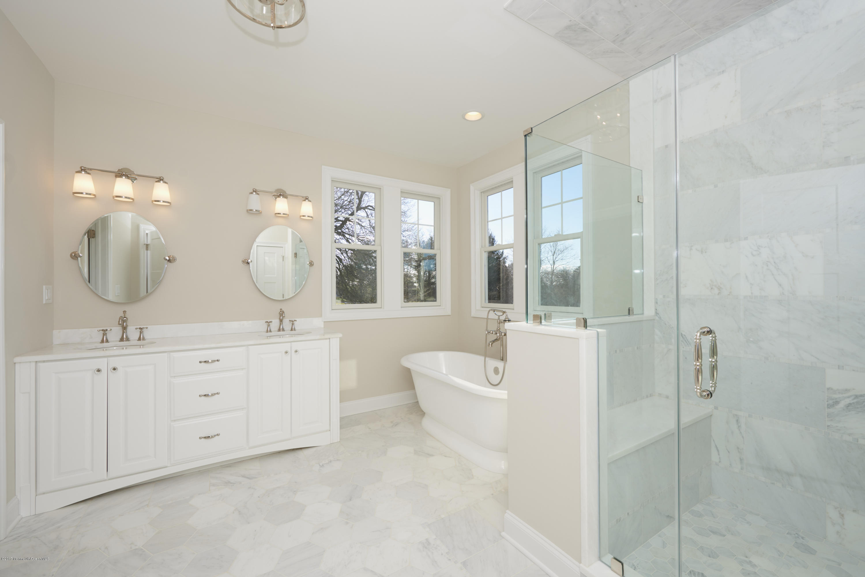 3 Forrest Way Colts Neck, NJ 07722 - Photo 20 of 26 a spacious bathroom with double vanity a mirror a lamp and bathtub