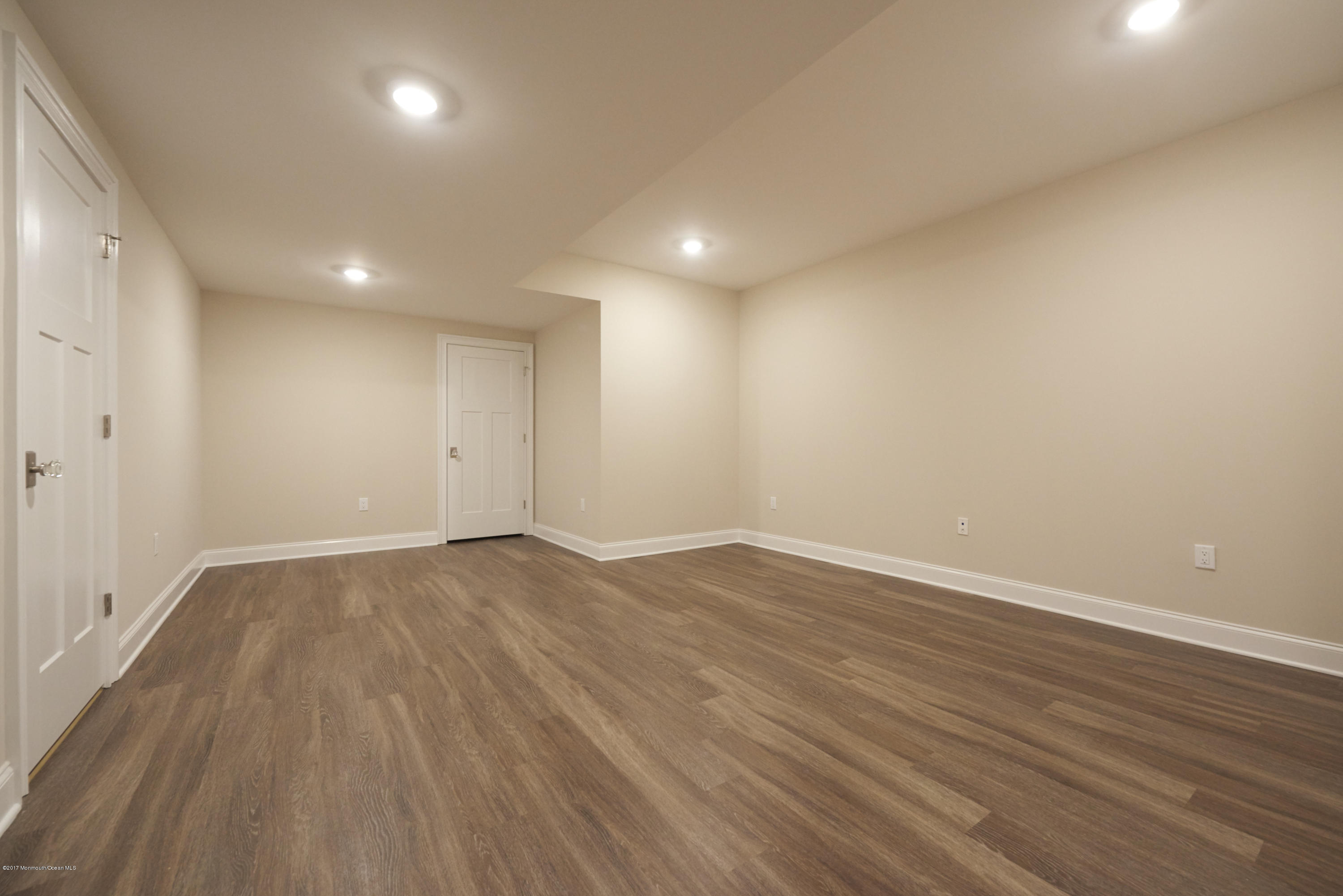 3 Forrest Way Colts Neck, NJ 07722 - Photo 25 of 26 an empty room with wooden floor and windows