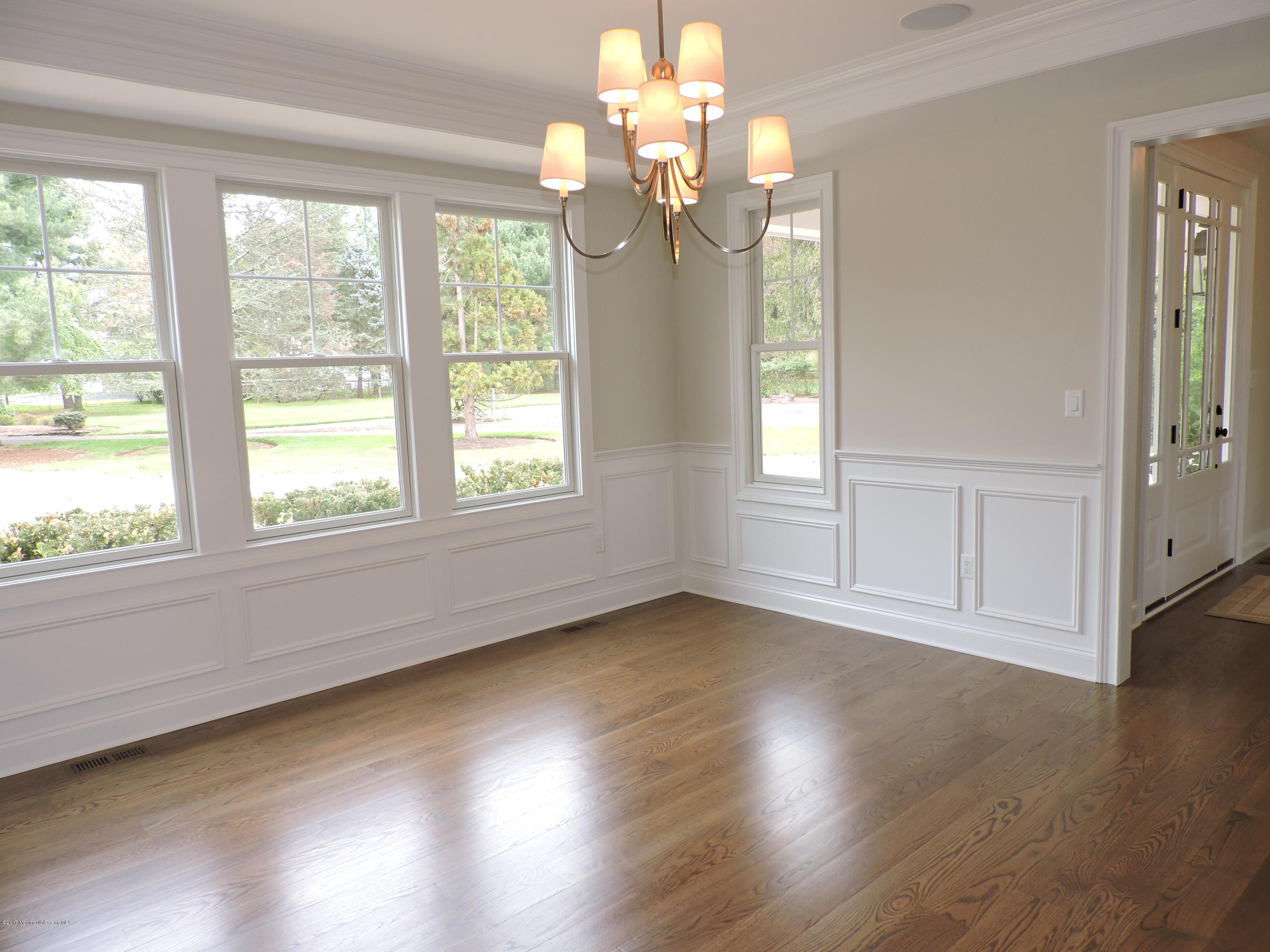 3 Forrest Way Colts Neck, NJ 07722 - Photo 6 of 26 a view of an empty room with wooden floor and a window