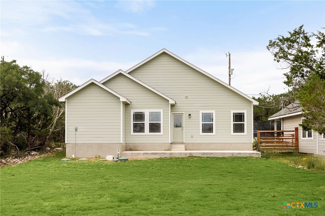 952 Rimrock Cove Spring Branch, TX 78070 - Photo 31 of 39 a view of a house with a backyard