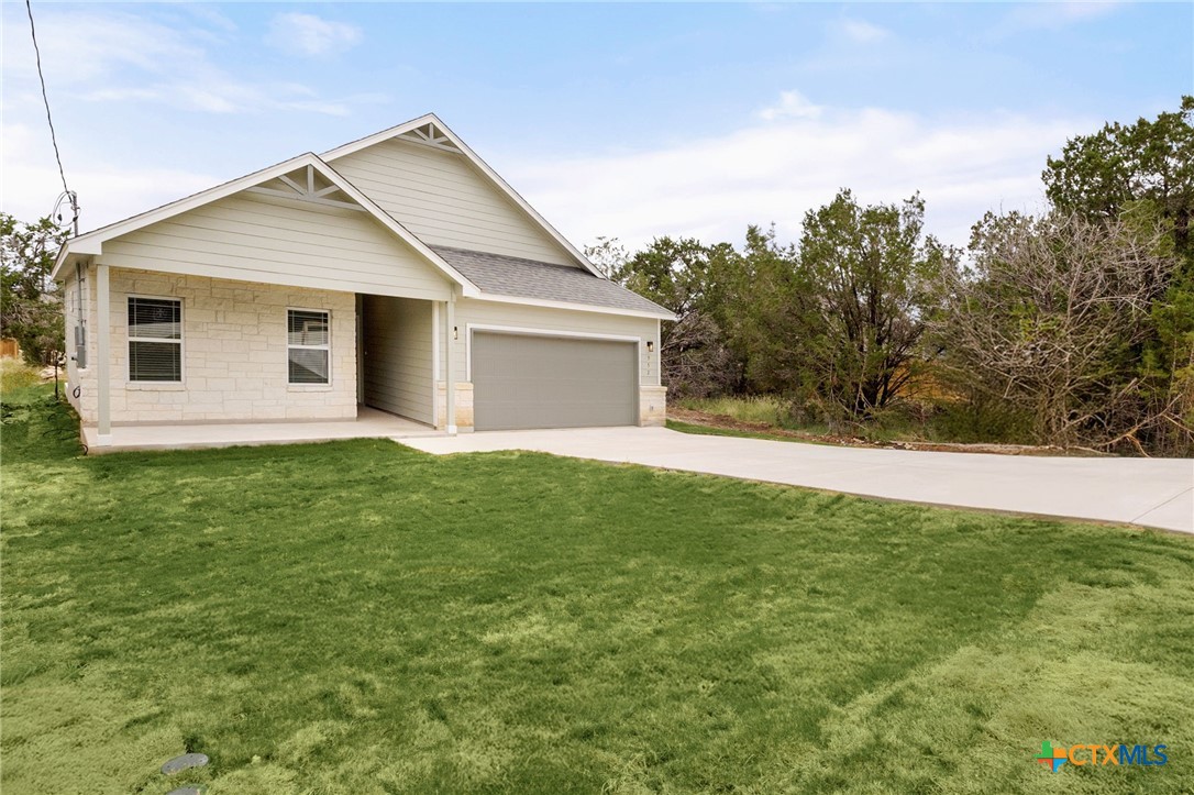 952 Rimrock Cove Spring Branch, TX 78070 - Photo 35 of 39 a front view of house with yard and trees