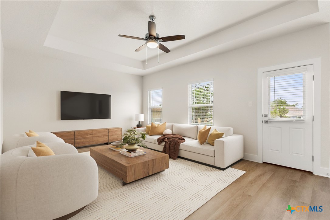 952 Rimrock Cove Spring Branch, TX 78070 - Photo 4 of 39 a living room with furniture and a flat screen tv