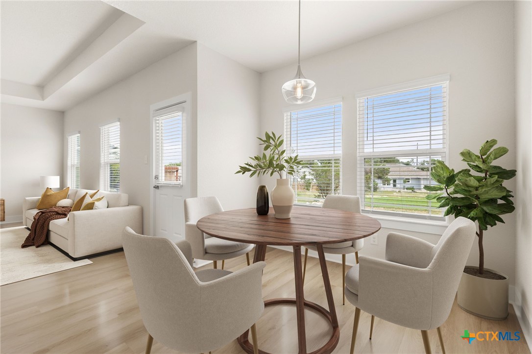 952 Rimrock Cove Spring Branch, TX 78070 - Photo 5 of 39 a view of a dining room with furniture window and wooden floor