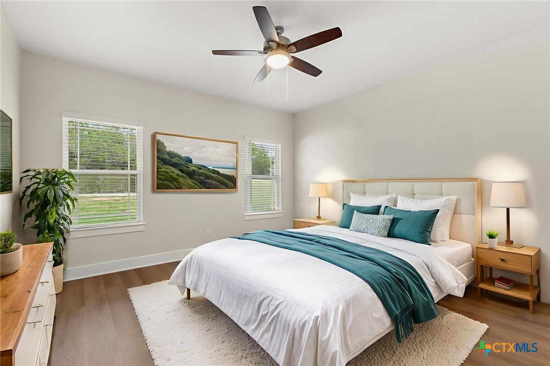 952 Rimrock Cove Spring Branch, TX 78070 - Photo 8 of 39 a bedroom with a large bed and a window