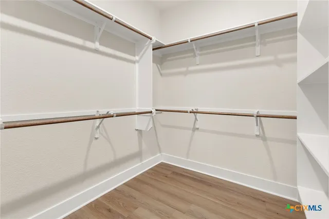 a view of an empty walk in closet