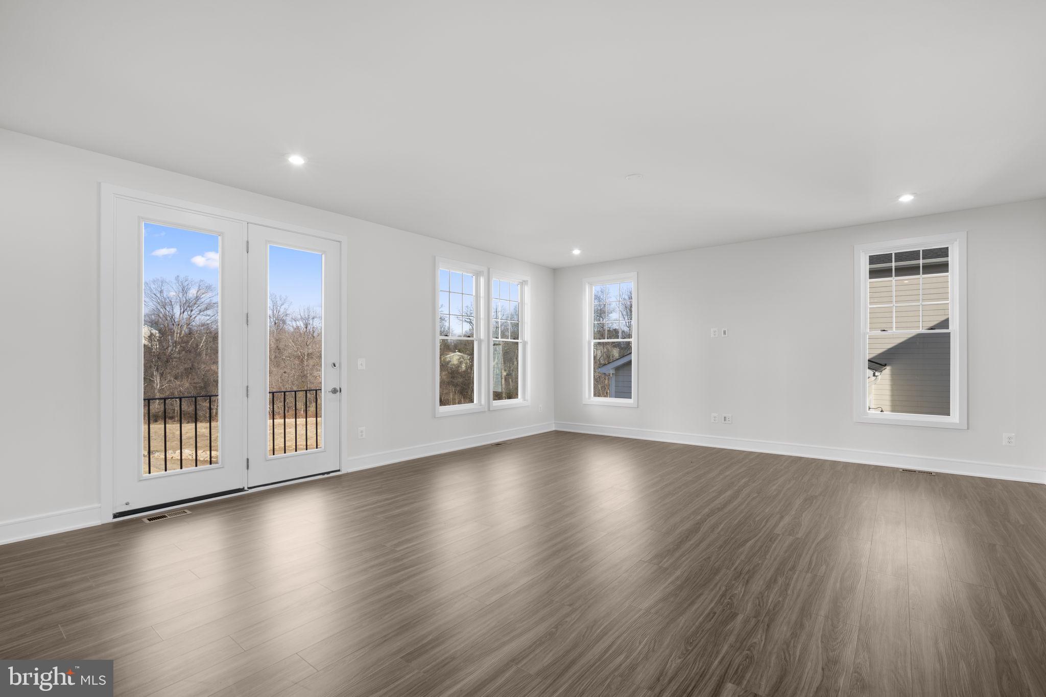 2611 Blue Rdg Avenue, Unit HOMESITE 139 Marshall, VA 20115 - Photo 13 of 49 a view of an empty room with wooden floor and a window