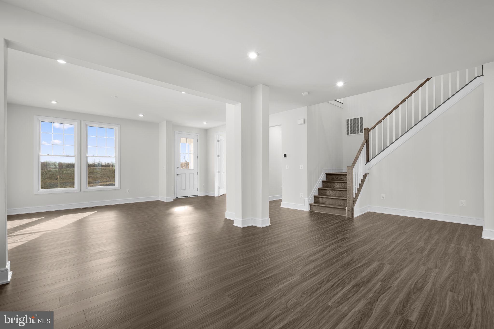 2611 Blue Rdg Avenue, Unit HOMESITE 139 Marshall, VA 20115 - Photo 16 of 49 a view of an empty room with wooden floor and stairs