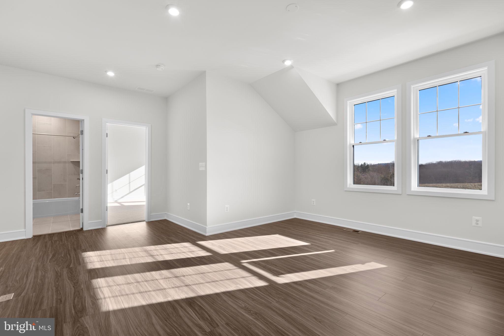 2611 Blue Rdg Avenue, Unit HOMESITE 139 Marshall, VA 20115 - Photo 19 of 49 a view of an empty room with wooden floor and a window