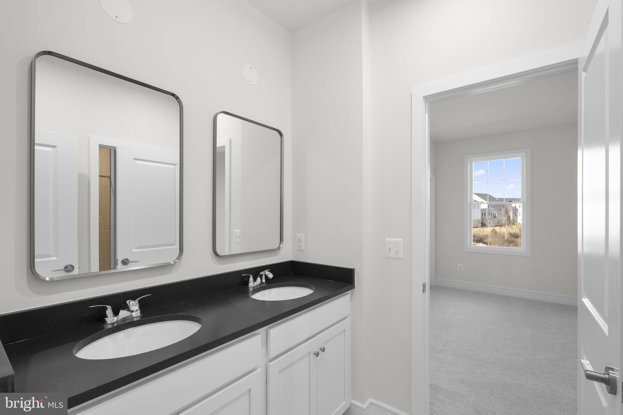 2611 Blue Rdg Avenue, Unit HOMESITE 139 Marshall, VA 20115 - Photo 23 of 49 a bathroom with double vanity sinks and a mirror