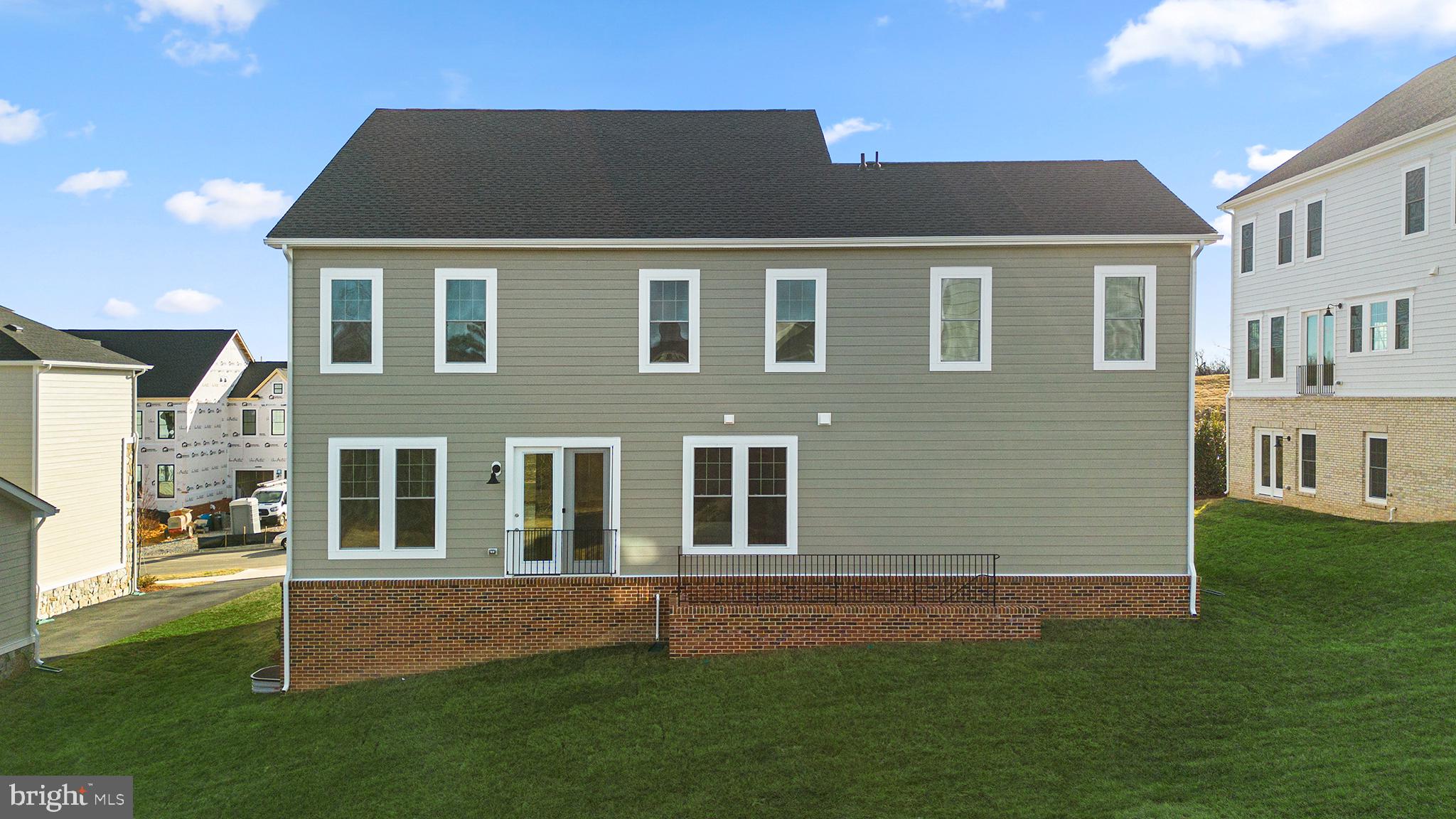 2611 Blue Rdg Avenue, Unit HOMESITE 139 Marshall, VA 20115 - Photo 33 of 49 a front view of a house with a garden
