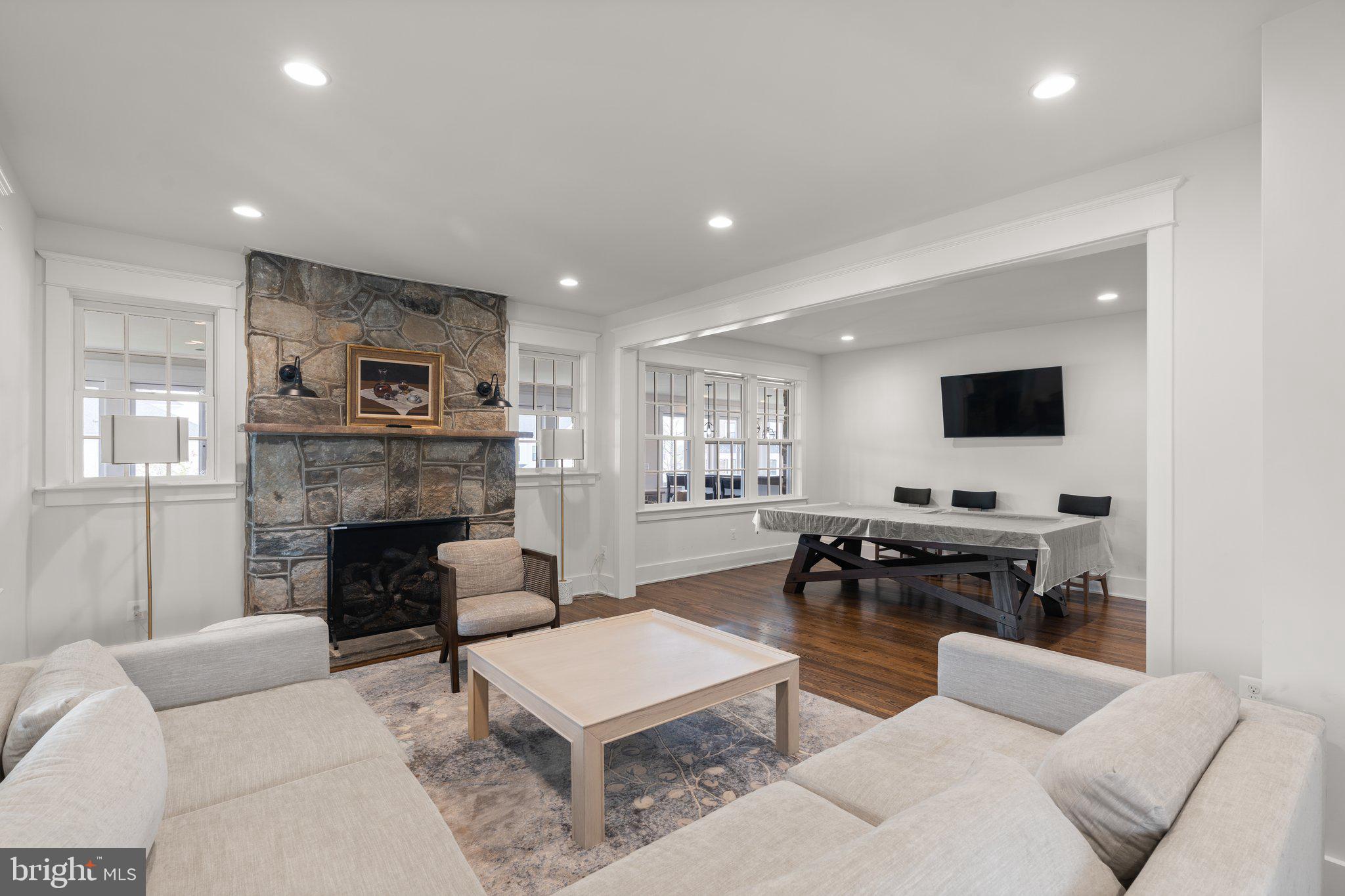 2611 Blue Rdg Avenue, Unit HOMESITE 139 Marshall, VA 20115 - Photo 43 of 49 a living room with furniture a fireplace and a flat screen tv