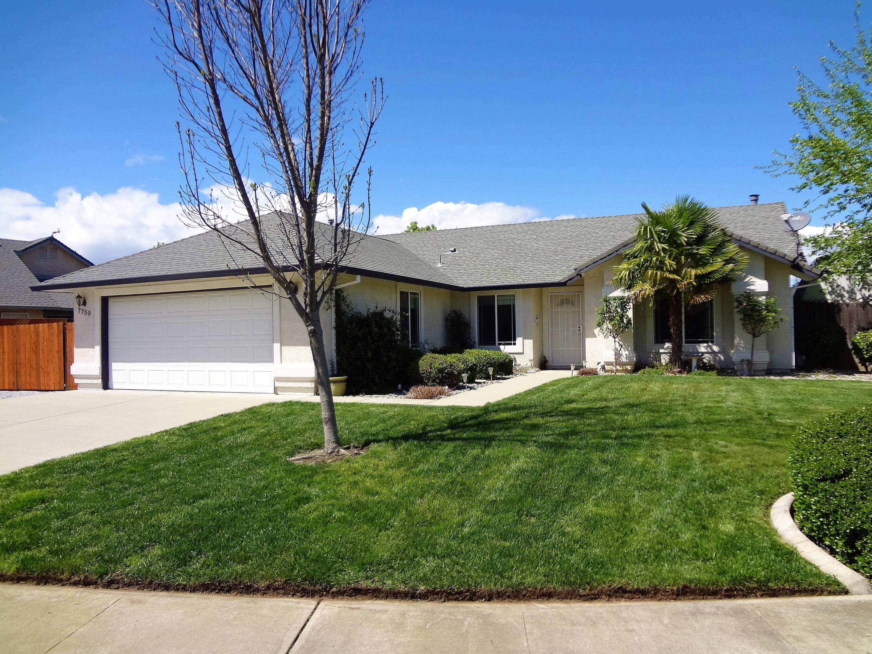 7759 Pit Road Redding, CA 96001 - Photo 1 of 47 a front view of a house with a yard