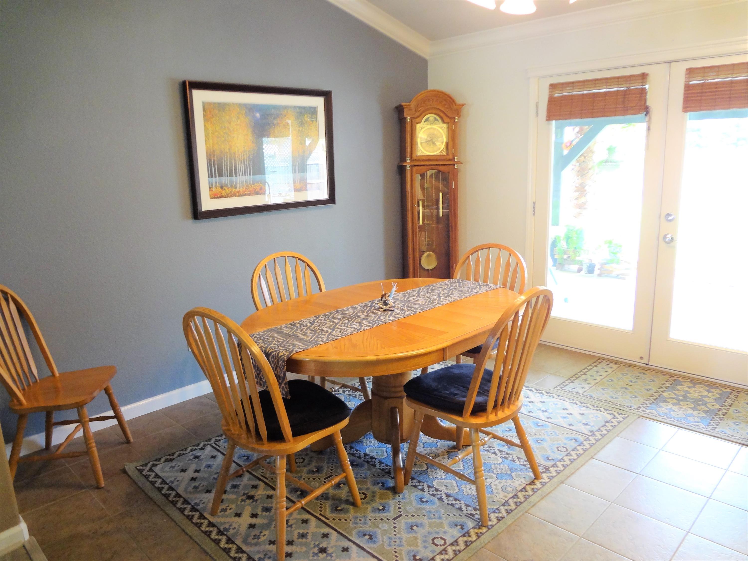 7759 Pit Road Redding, CA 96001 - Photo 14 of 47 a dining room with furniture and window
