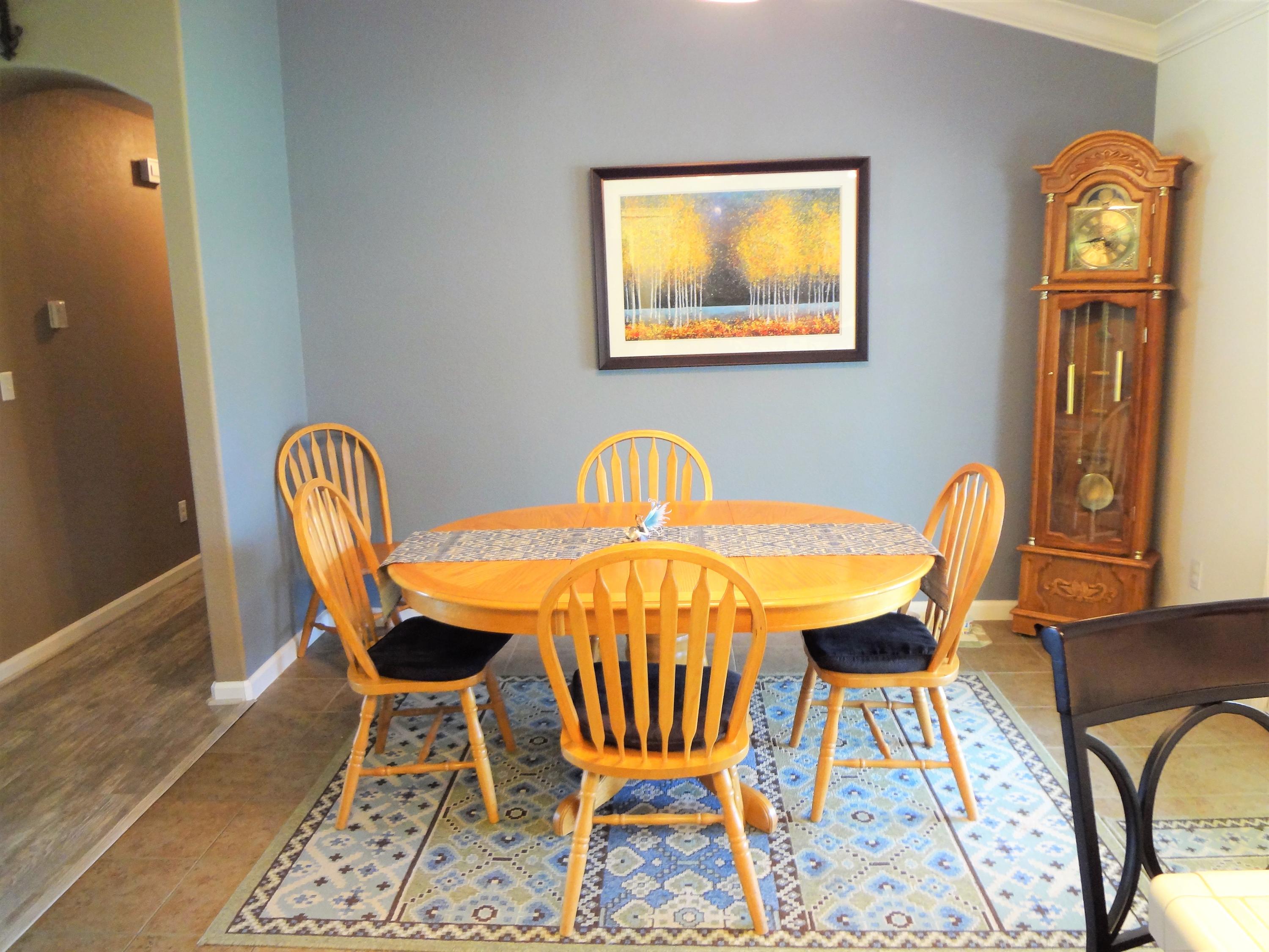 7759 Pit Road Redding, CA 96001 - Photo 15 of 47 a dining room with furniture and wooden floor