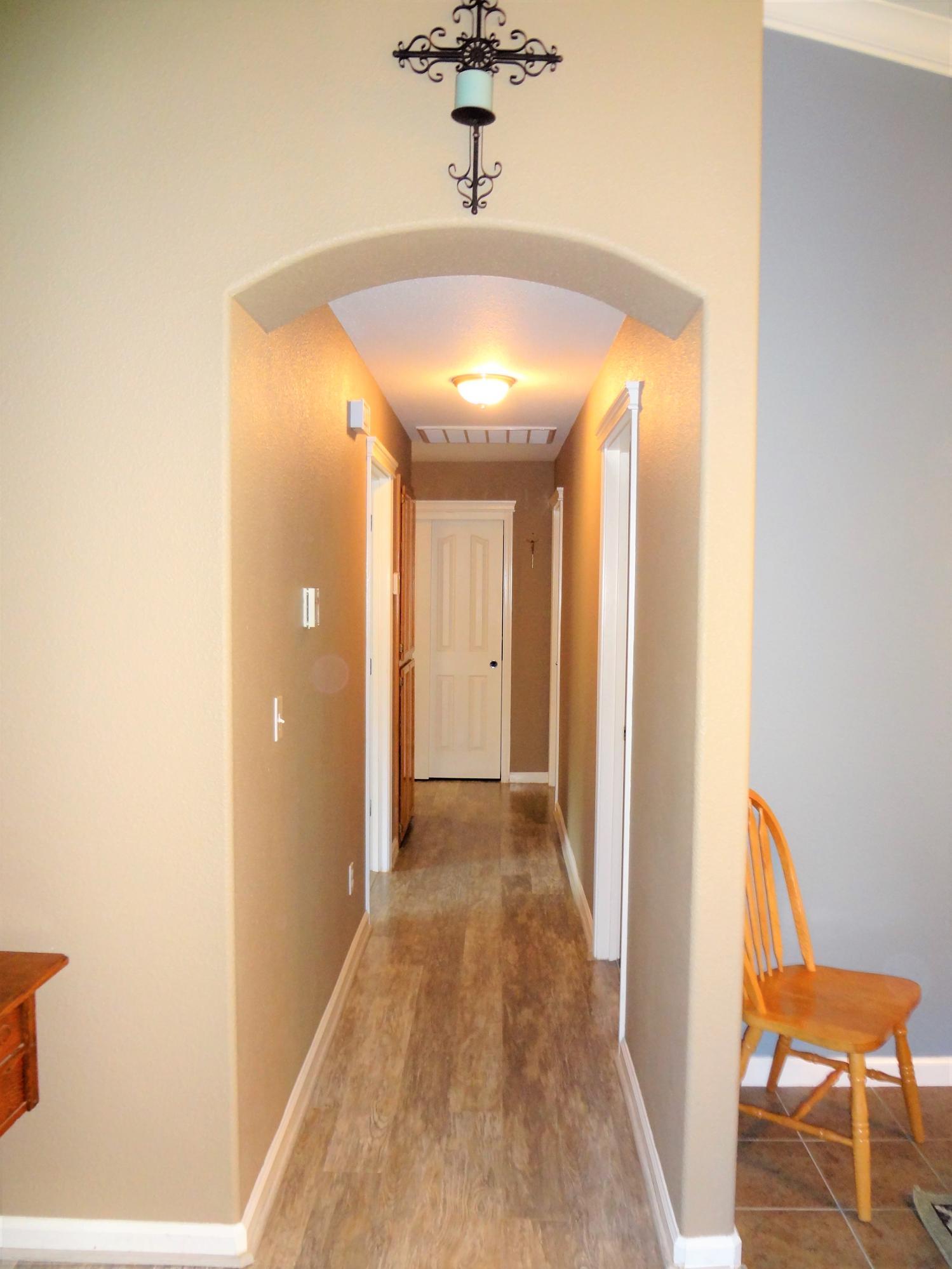 7759 Pit Road Redding, CA 96001 - Photo 16 of 47 a view of a hallway with a chandelier