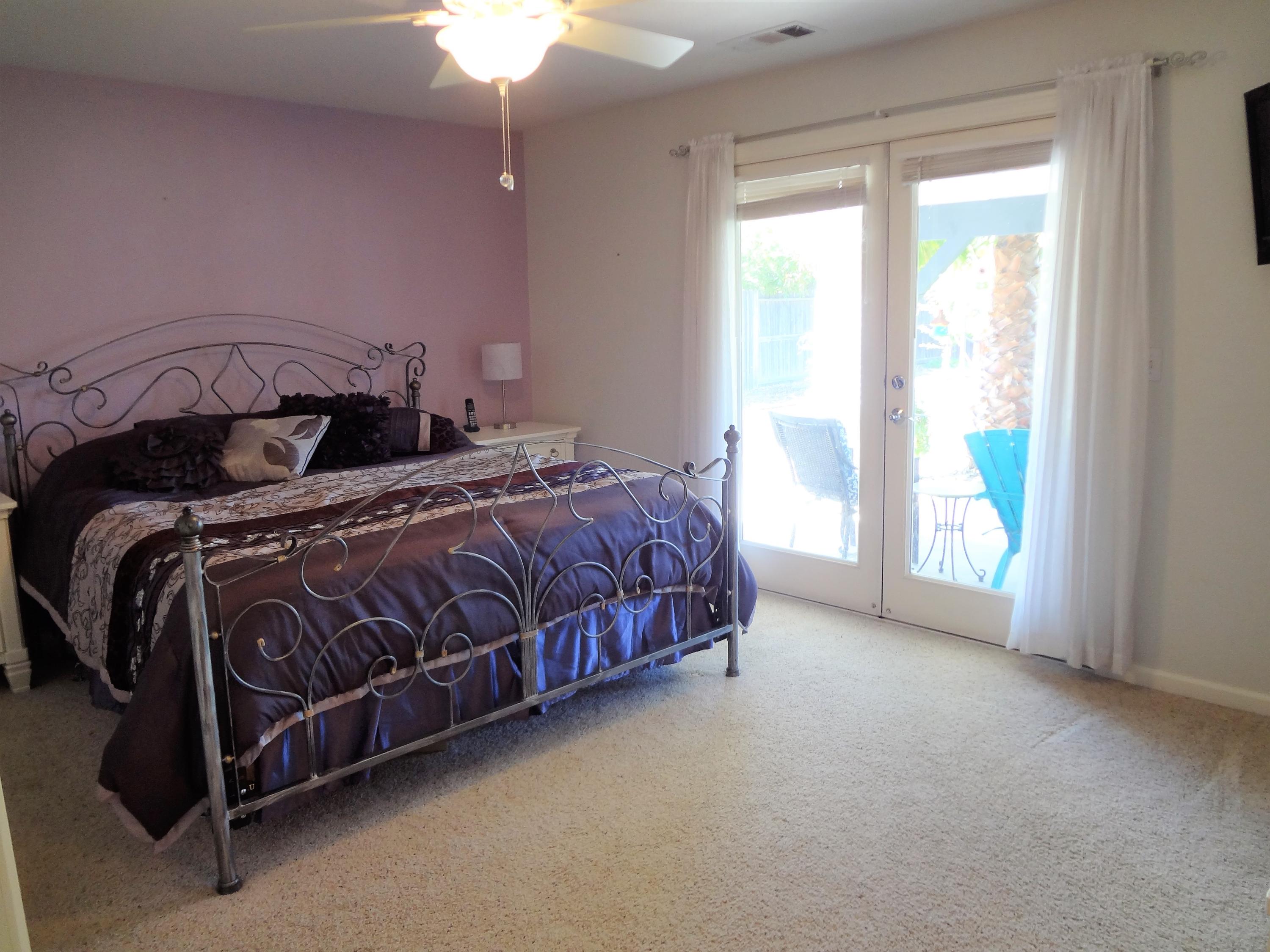 7759 Pit Road Redding, CA 96001 - Photo 17 of 47 a bed sitting in a bedroom next to a window