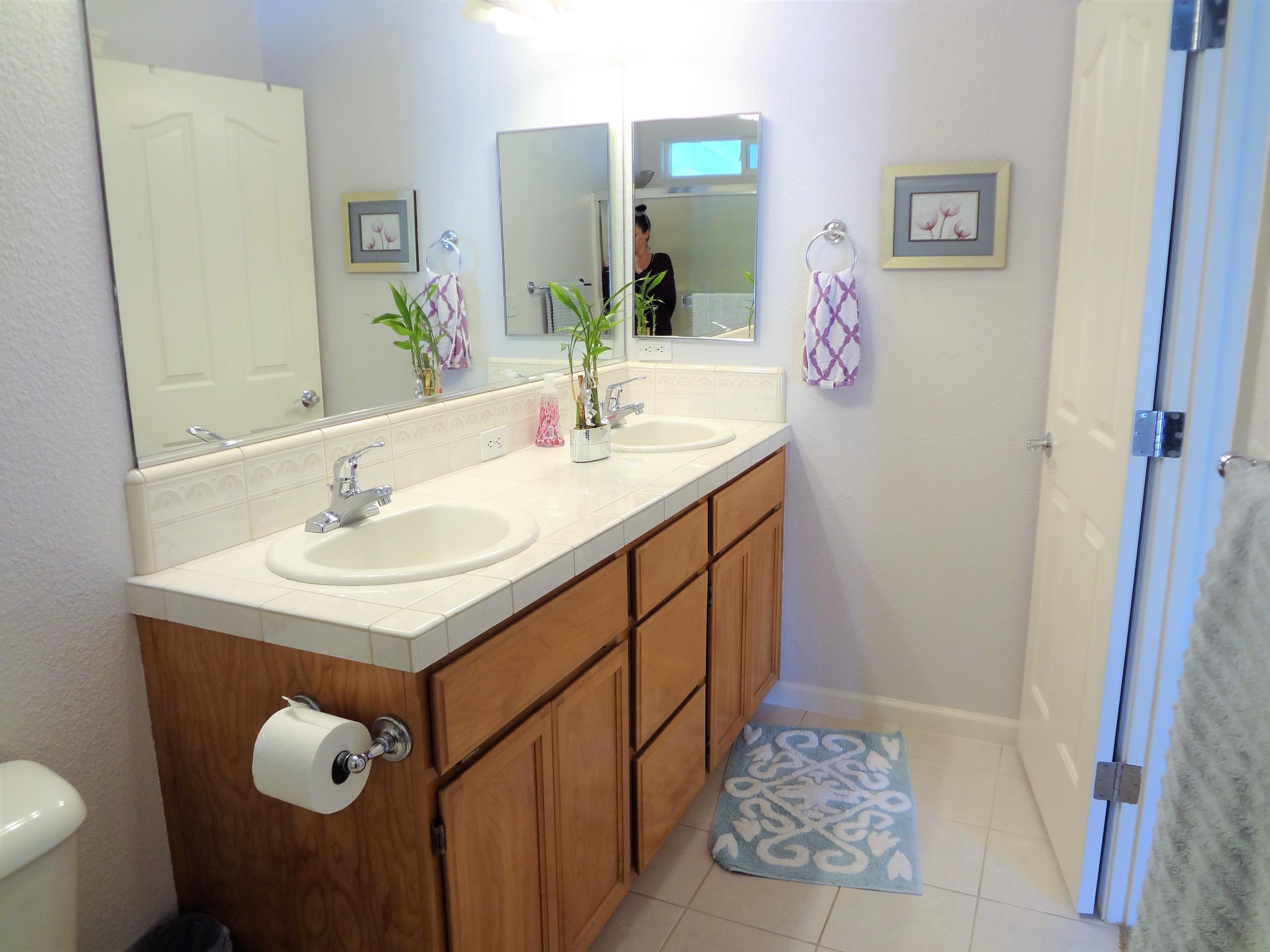 7759 Pit Road Redding, CA 96001 - Photo 20 of 47 a bathroom with a sink vanity and a mirror