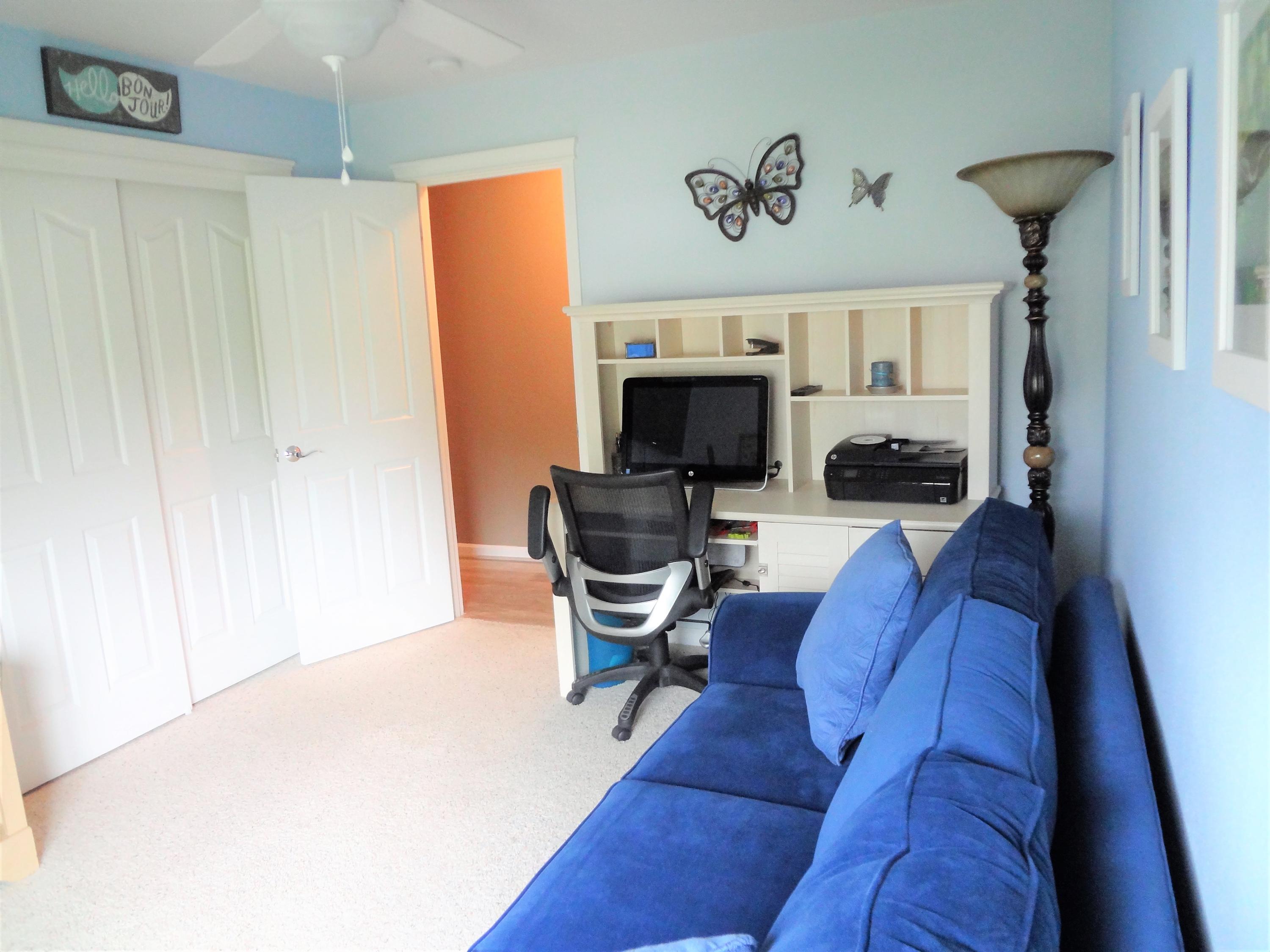 7759 Pit Road Redding, CA 96001 - Photo 23 of 47 a living room with furniture and a fireplace