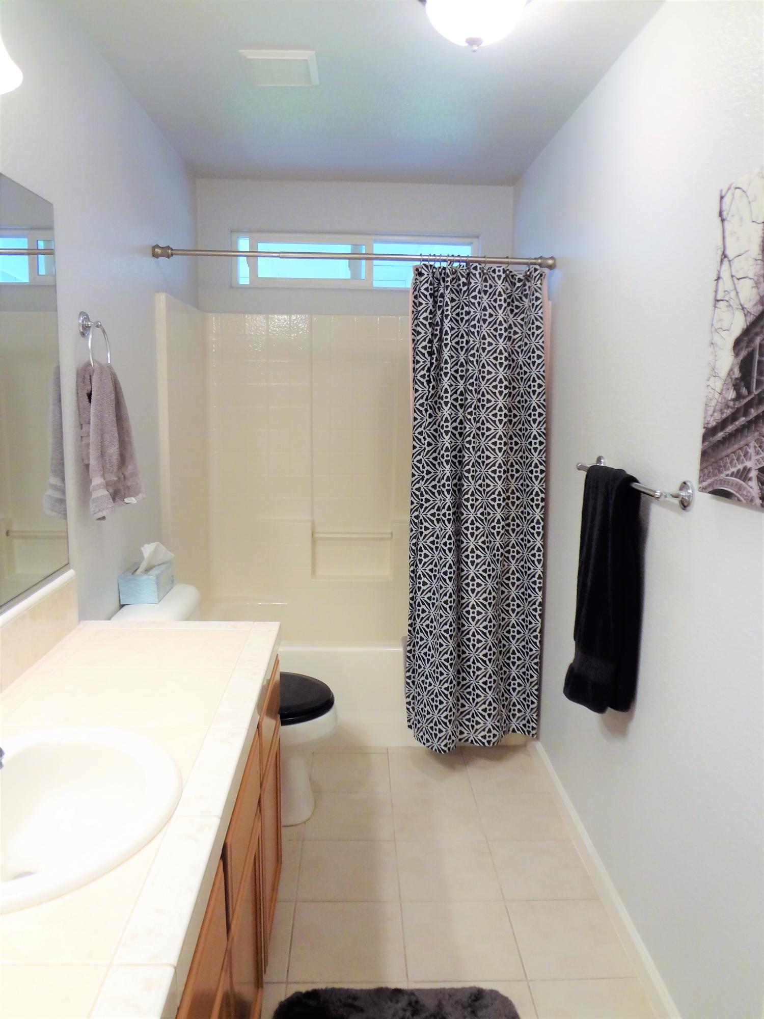 7759 Pit Road Redding, CA 96001 - Photo 25 of 47 a bathroom with a sink and a shower