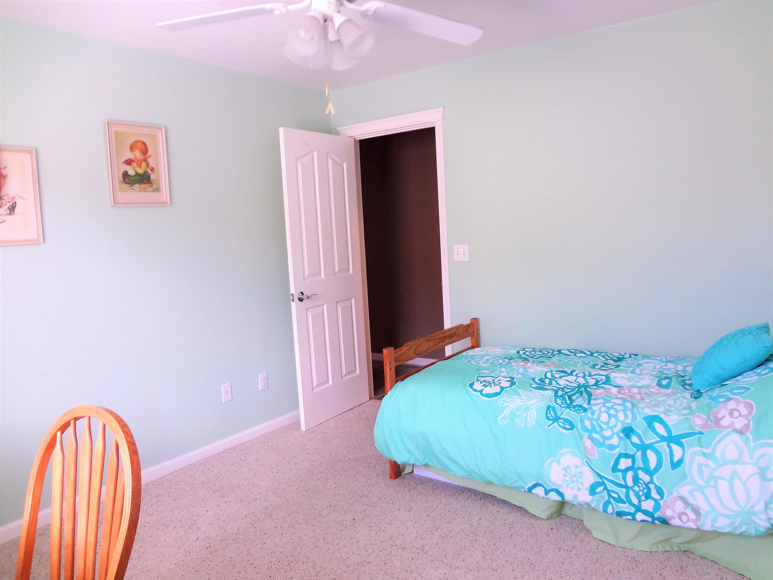 7759 Pit Road Redding, CA 96001 - Photo 27 of 47 a bedroom with a bed and a painting on the wall