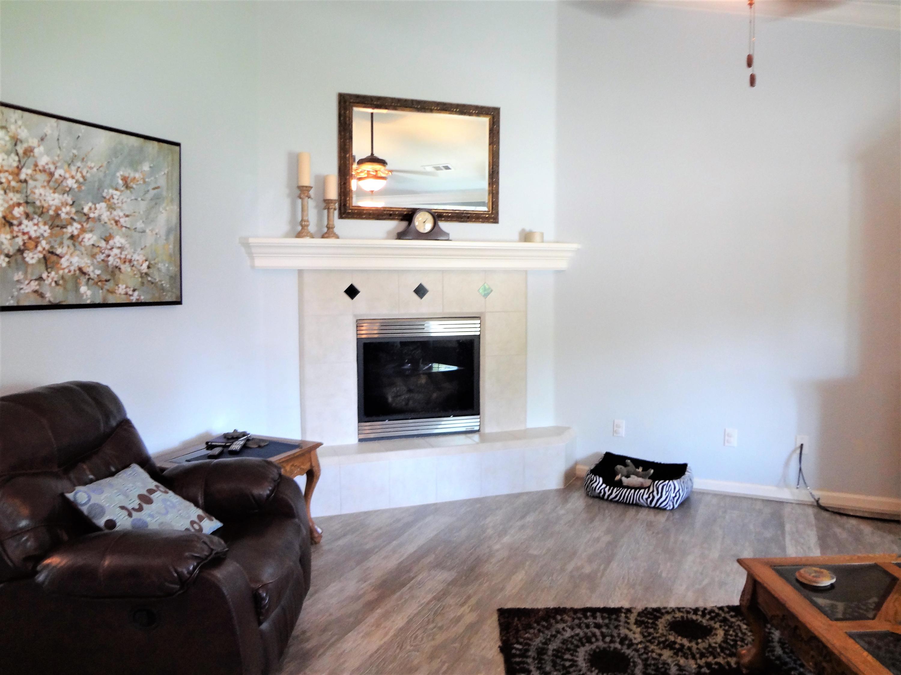 7759 Pit Road Redding, CA 96001 - Photo 5 of 47 a living room with furniture and a fireplace
