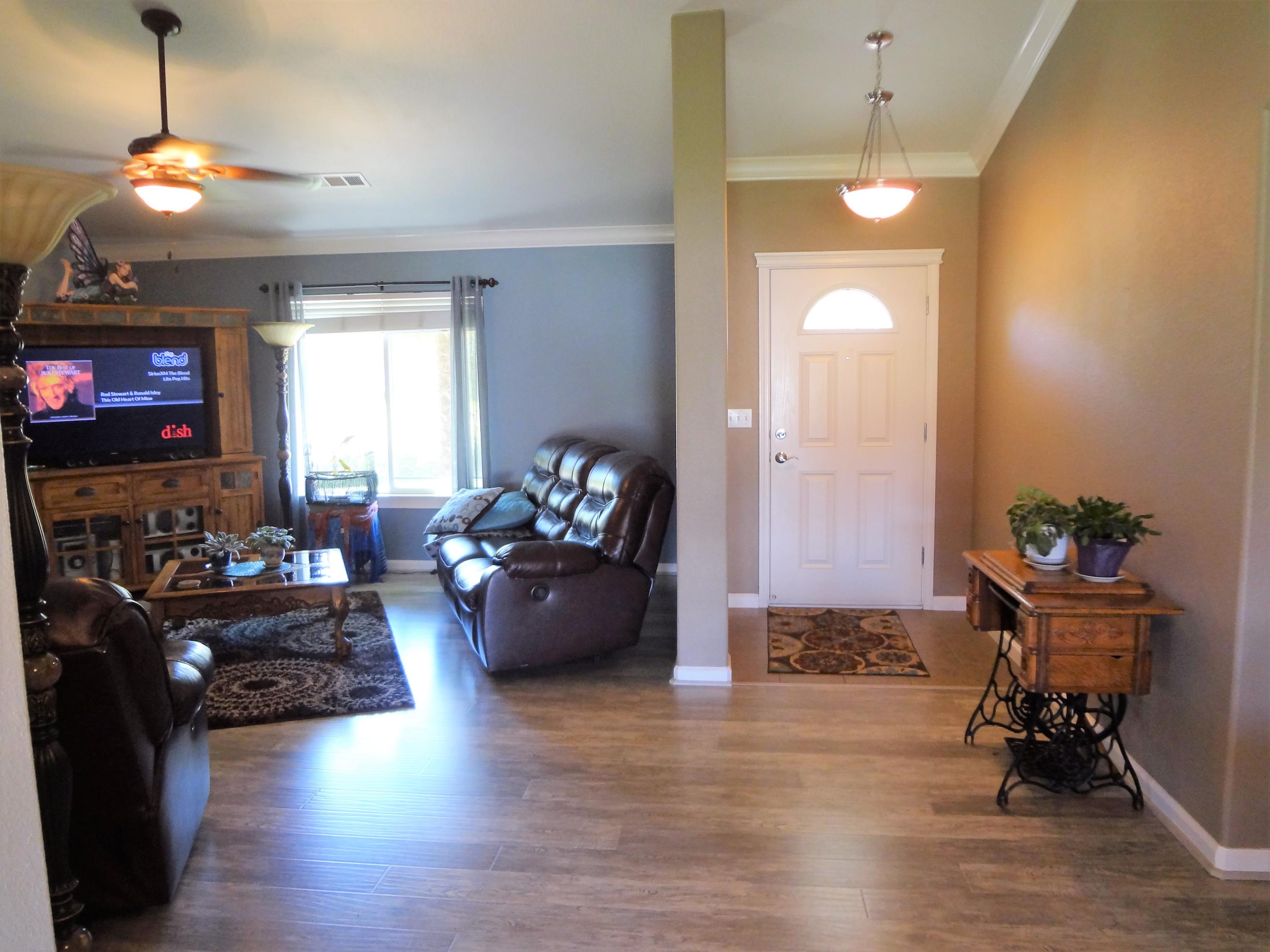 7759 Pit Road Redding, CA 96001 - Photo 6 of 47 a living room with furniture and a chandelier
