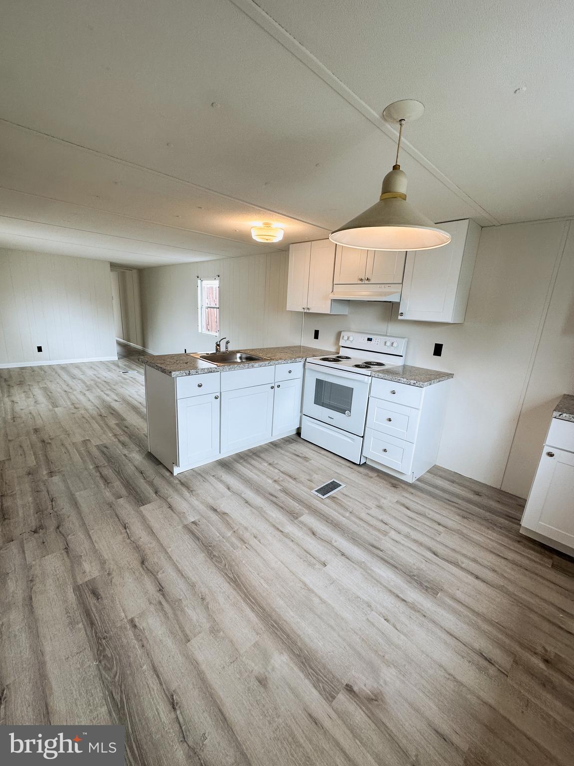 600 Convent Road, Unit 3 Aston, PA 19014 - Photo 2 of 7 a large kitchen with kitchen island a sink stainless steel appliances and cabinets