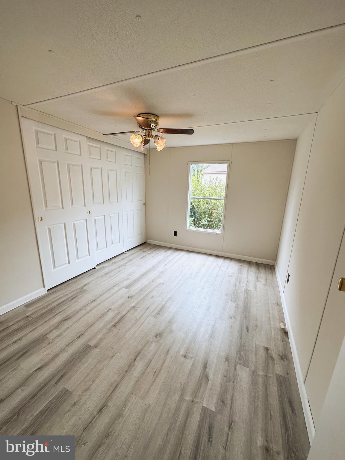 600 Convent Road, Unit 3 Aston, PA 19014 - Photo 7 of 7 a view of an empty room with wooden floor and a window
