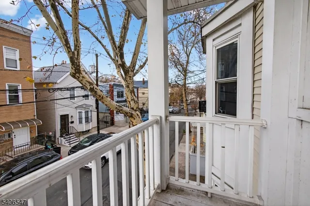 a view of a house with wooden fence and windows