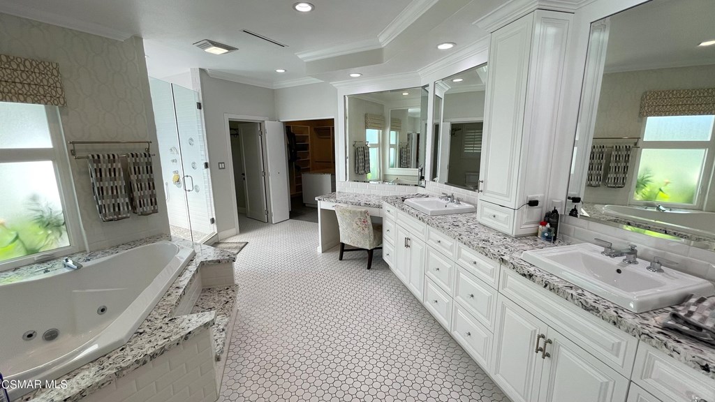 780 Gloucester Lane Thousand Oaks, CA 91362 - Photo 12 of 32 a large white bathroom with a granite countertop double vanity sink a mirror and a bathtub
