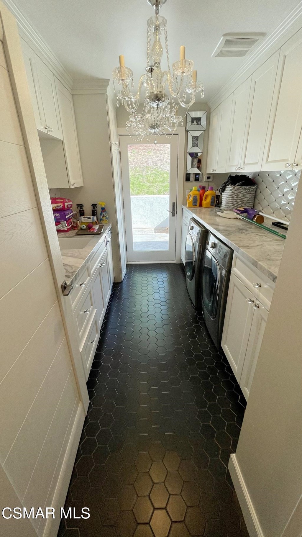780 Gloucester Lane Thousand Oaks, CA 91362 - Photo 22 of 32 a kitchen with granite countertop a stove a sink dishwasher and a fireplace with wooden floor