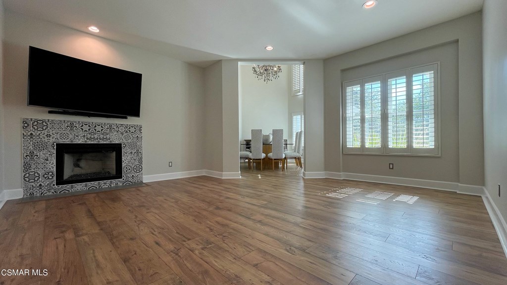 780 Gloucester Lane Thousand Oaks, CA 91362 - Photo 3 of 32 a view of empty room with wooden floor and fireplace