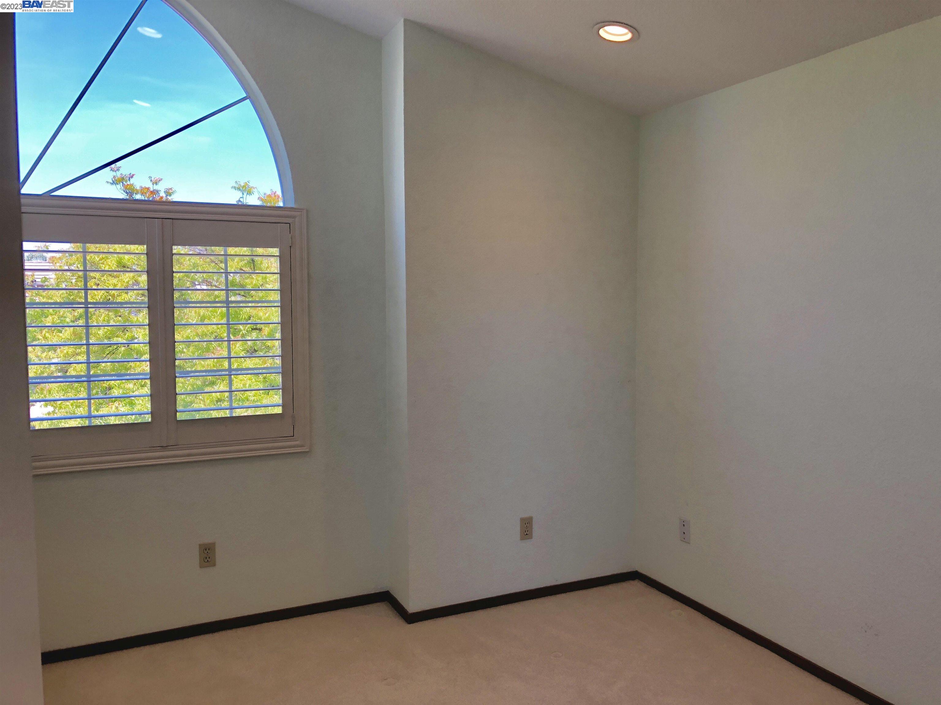 3047 Badger Drive Pleasanton, CA 94566 - Photo 16 of 18 an empty room with a window