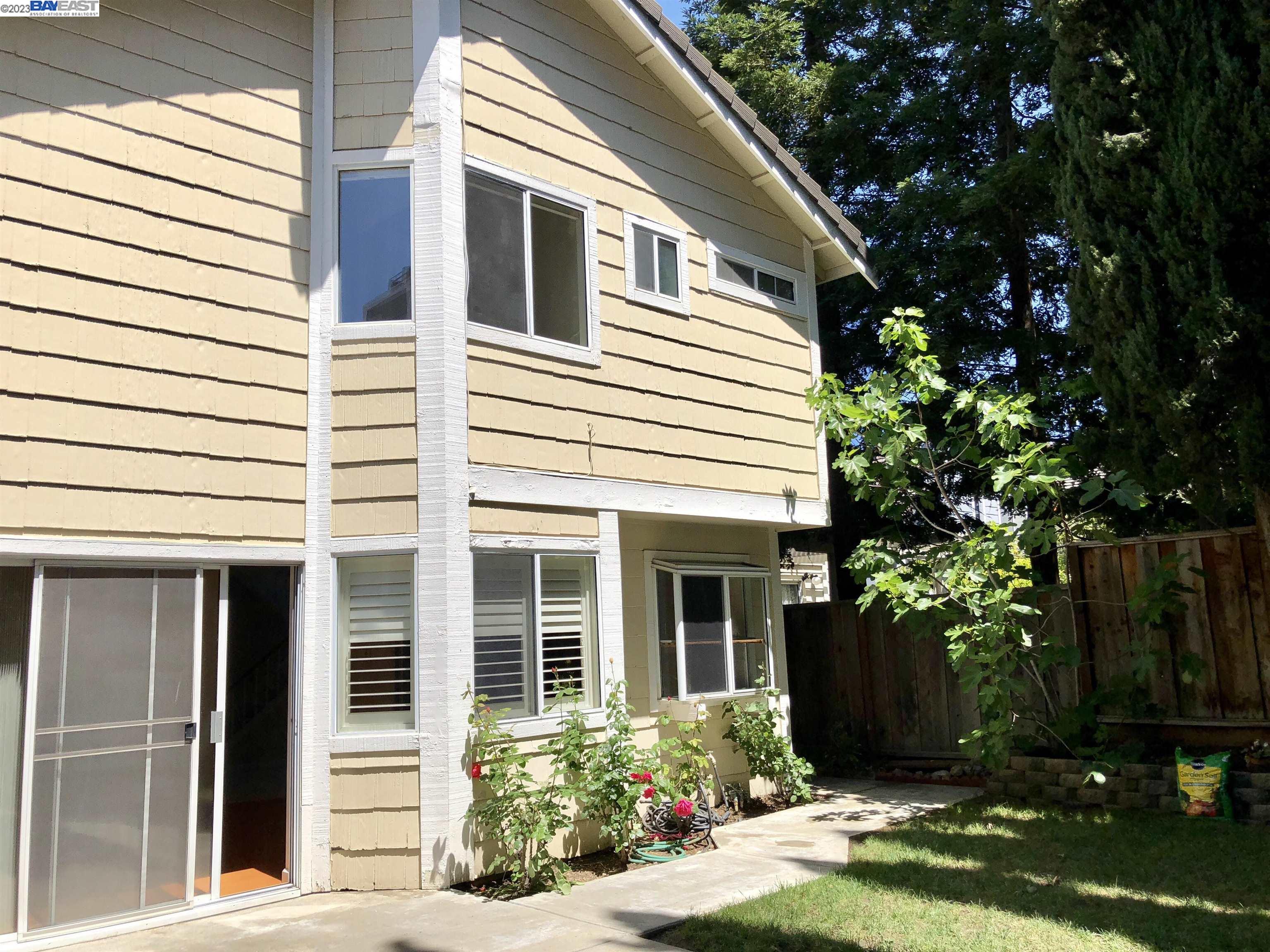 3047 Badger Drive Pleasanton, CA 94566 - Photo 2 of 18 a view of a white house next to a yard