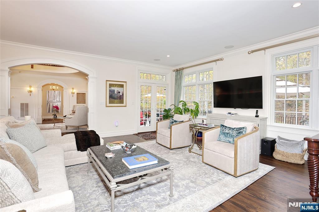 164 Deerhaven Road Mahwah, NJ 07430 - Photo 12 of 42 a living room with furniture a flat screen tv and white walls