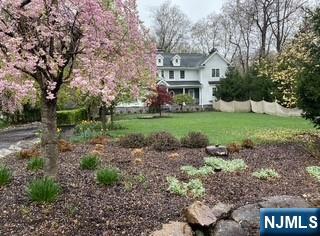 164 Deerhaven Road Mahwah, NJ 07430 - Photo 4 of 42 a front view of a house with a yard