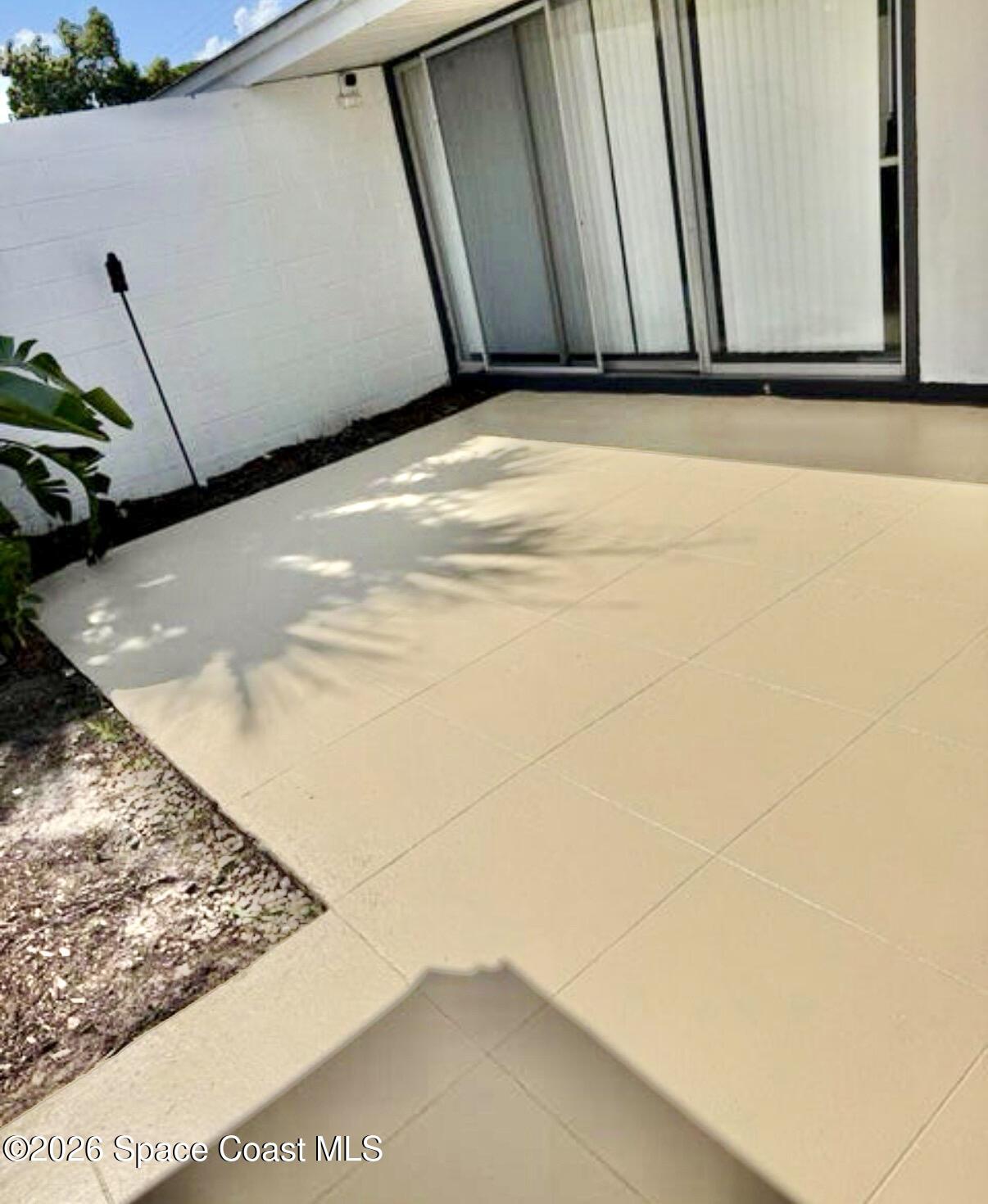 938 Brunswick Lane Rockledge, FL 32955 - Photo 18 of 21 Frnt courtyard off DR w/o furn.