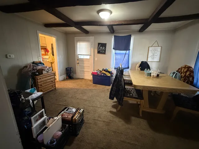 a kitchen with a sink appliances and cabinets