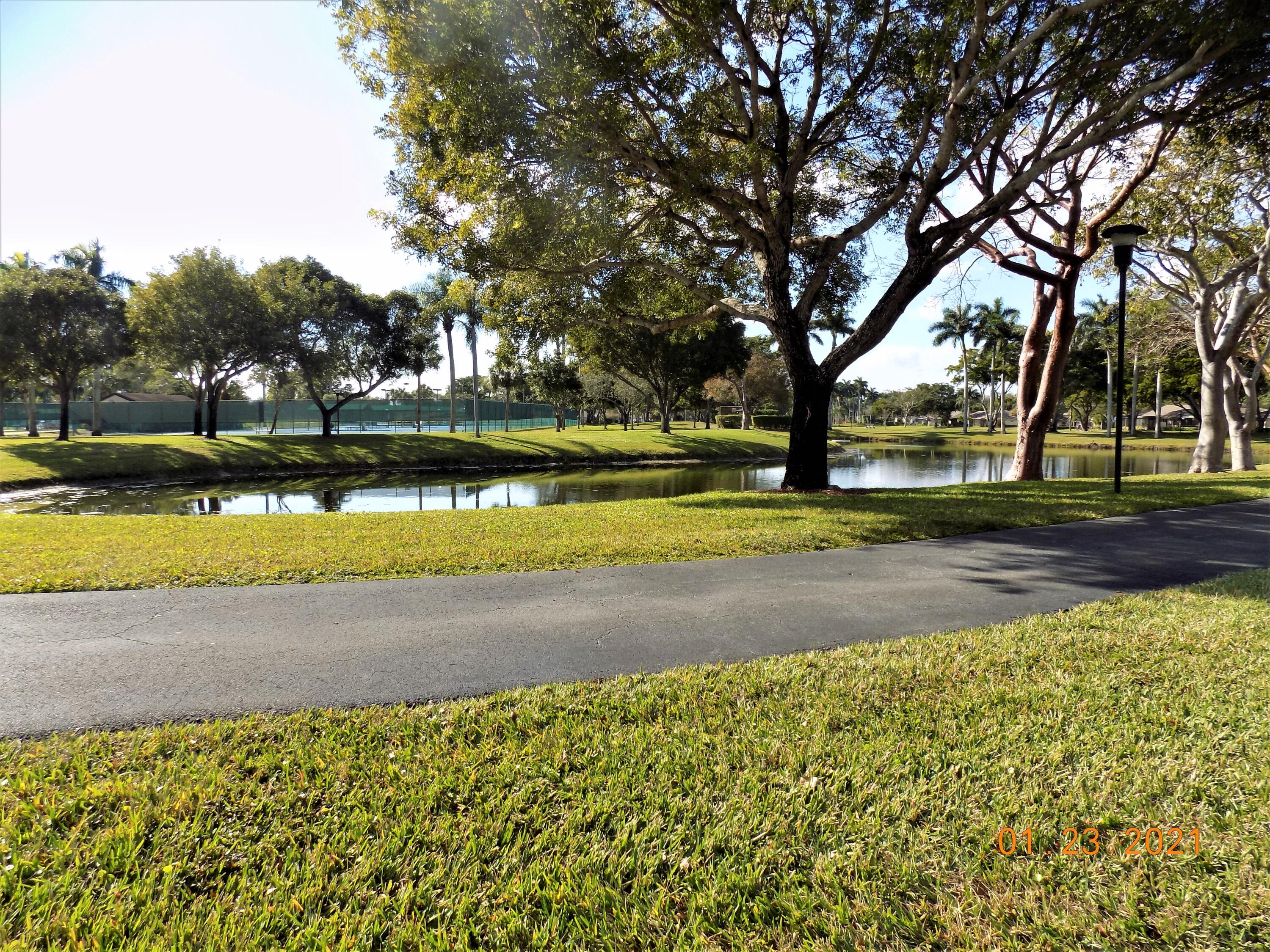 8059 Hiddenview Terrace Boca Raton, FL 33496 - Photo 39 of 39 WALKING TRAIL AROUND LAKES TENNIS