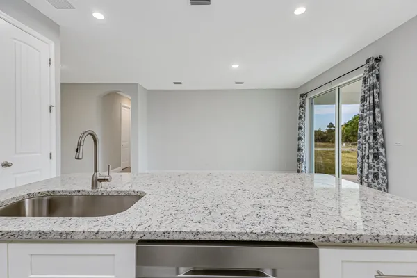 a kitchen with granite countertop a sink and a granite counter tops