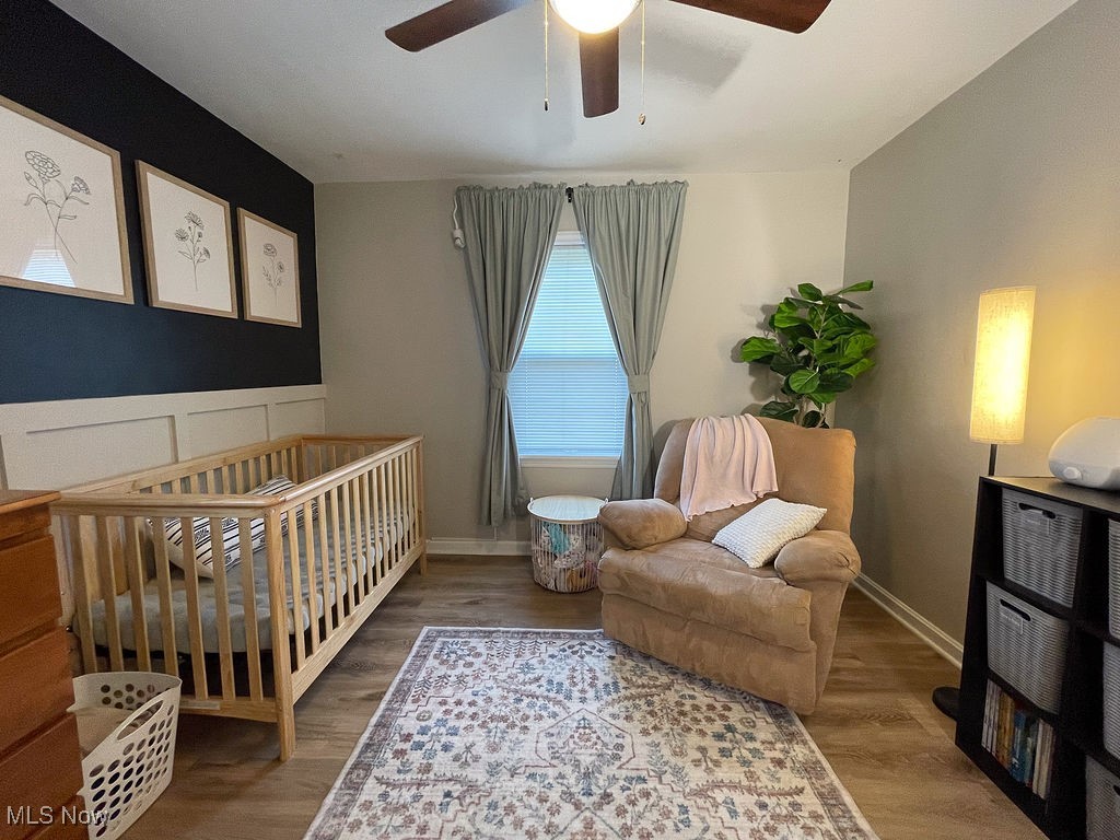 2707 Hearthstone Road Cleveland, OH 44134 - Photo 24 of 49 Bedroom with baseboards, ceiling fan, and wood finished floors