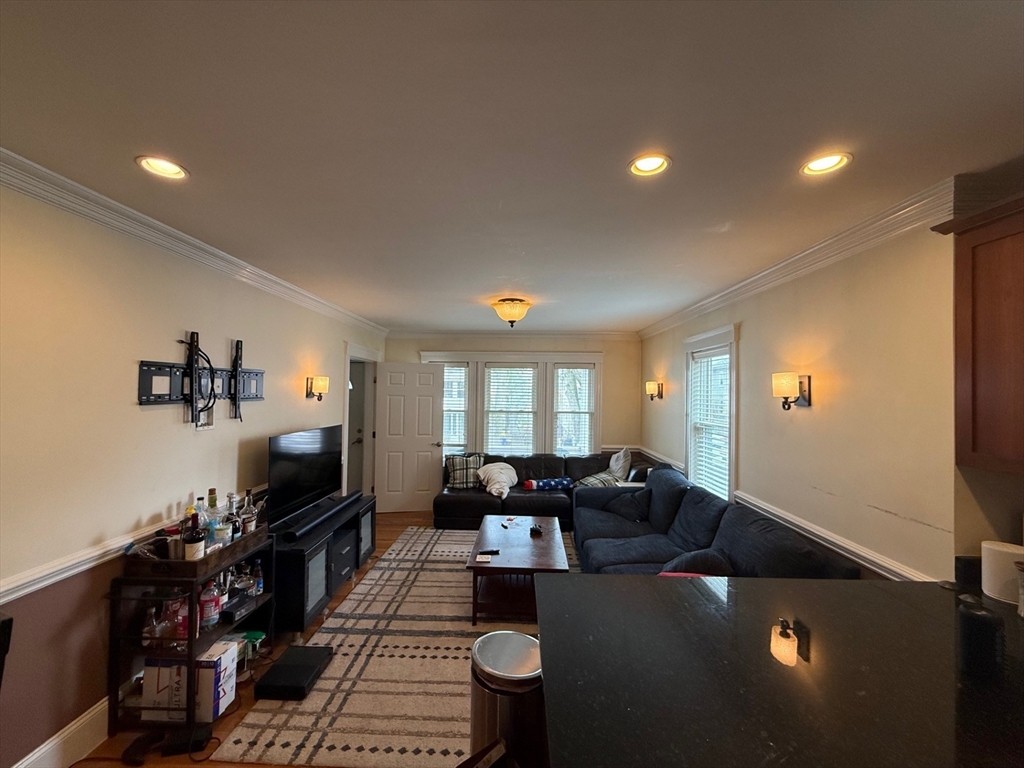 72 Bennett Street, Unit 72 Boston, MA 02135 - Photo 4 of 17 a living room with furniture and a flat screen tv