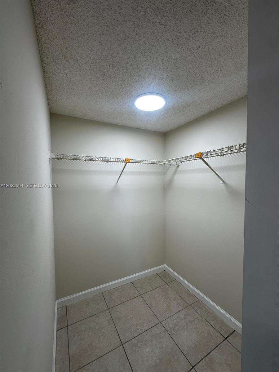 3400 Foxcroft Road, Unit 301 Miramar, FL 33025 - Photo 46 of 72 a view of a room with racks on the wall