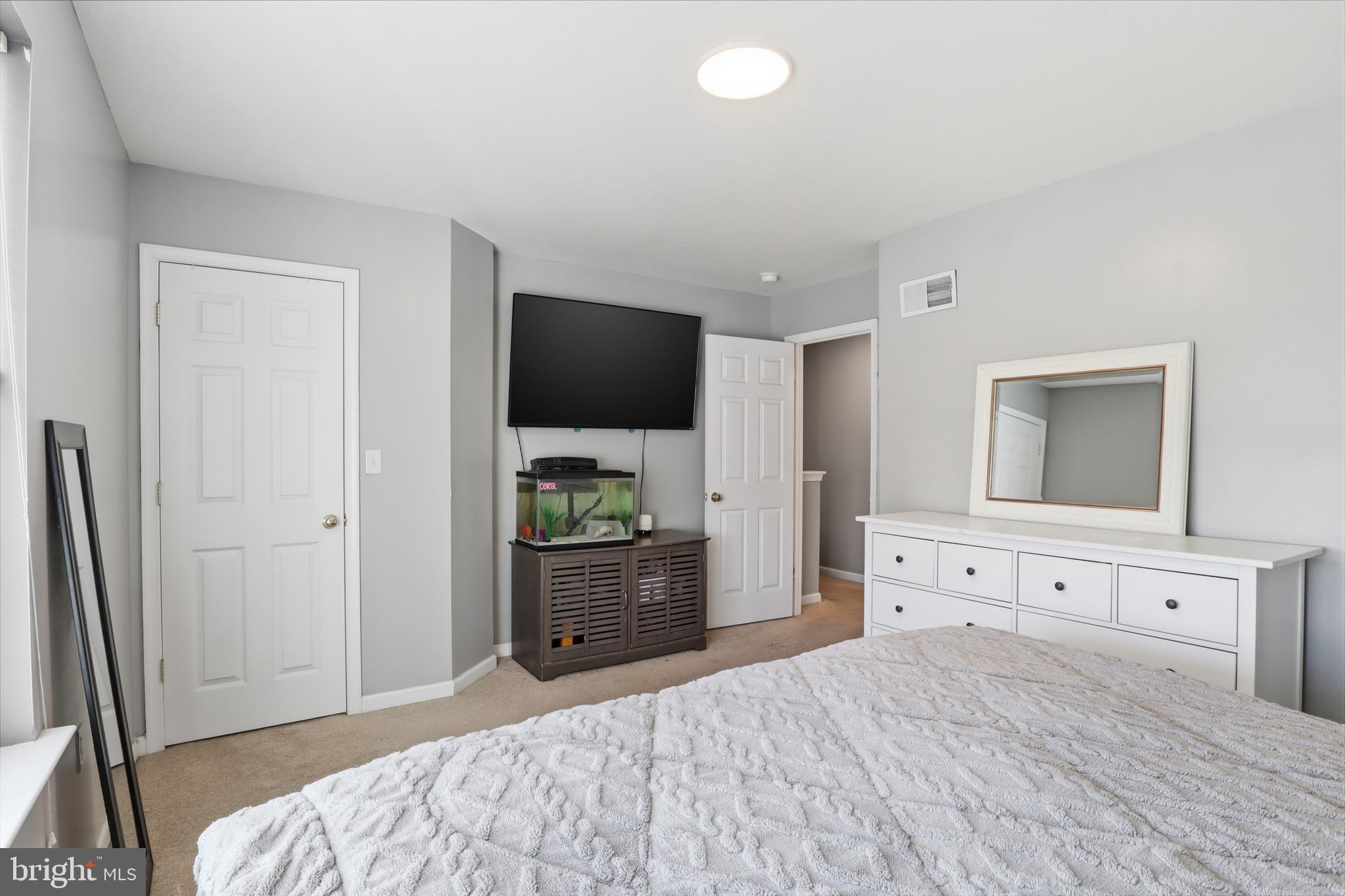 348 Cape Climb York, PA 17408 - Photo 22 of 29 a bedroom with a bed and a flat screen tv