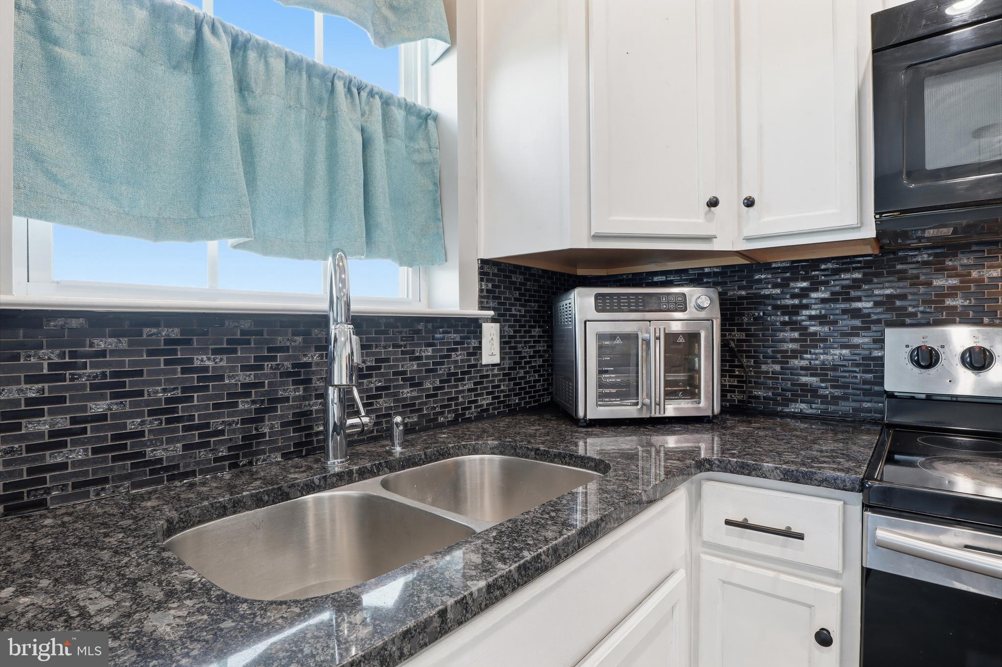 348 Cape Climb York, PA 17408 - Photo 8 of 29 a kitchen with granite countertop a sink and a stove