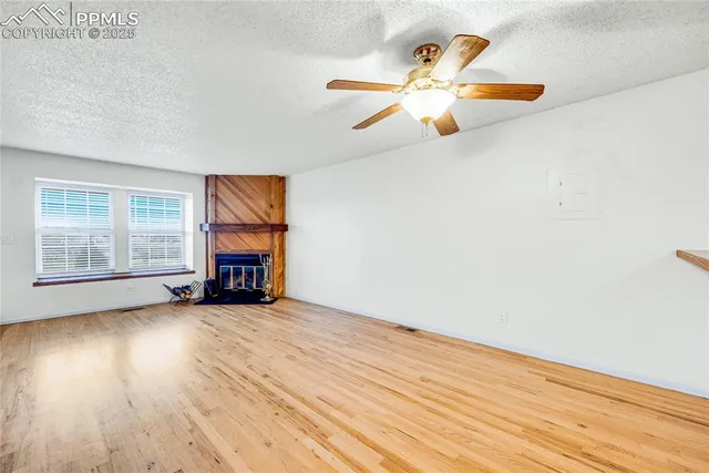 a kitchen with granite countertop a sink stainless steel appliances and cabinets